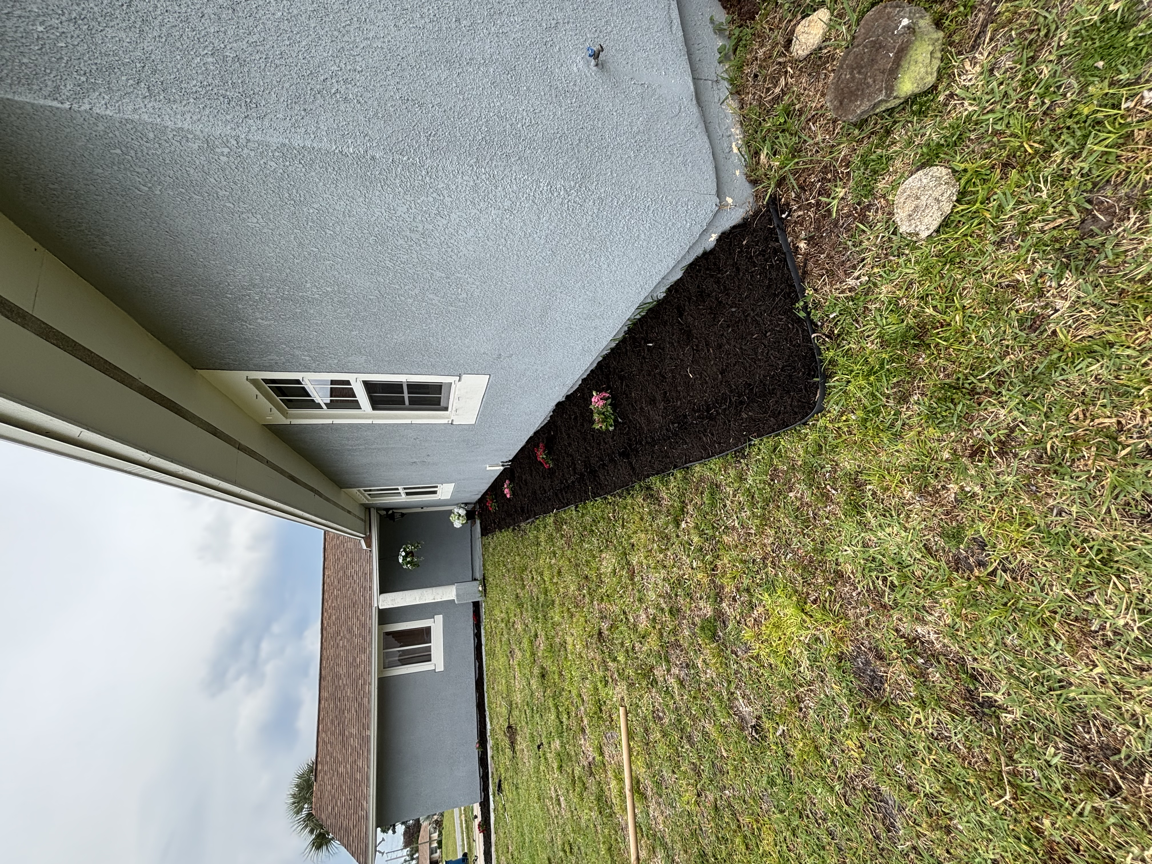 Fresh mulch bed and landscape planting installation in Melbourne FL